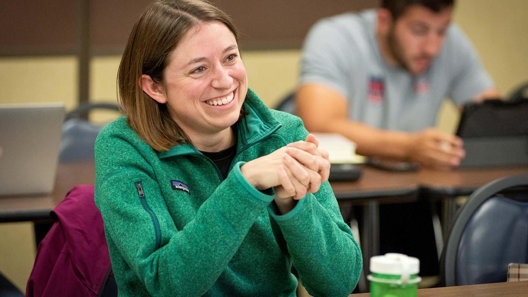 Smiling adult student attending evening class